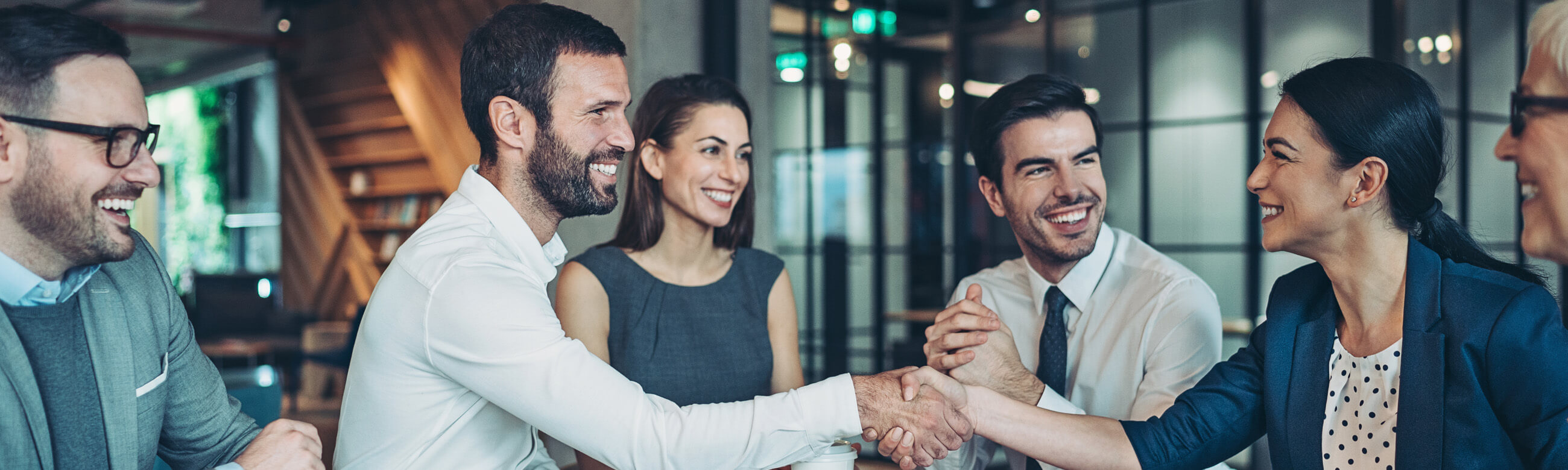 a group of colleagues huddled in a discussion