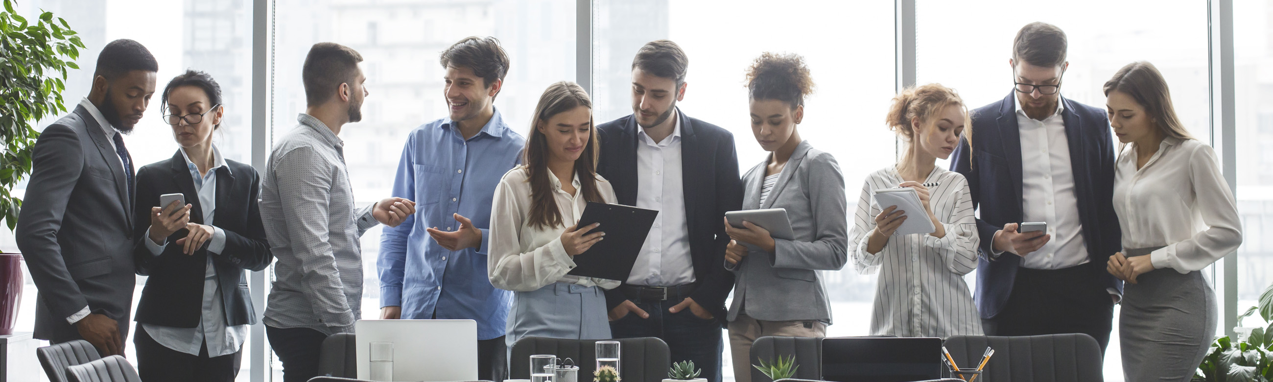 a group of colleagues huddled in a discussion